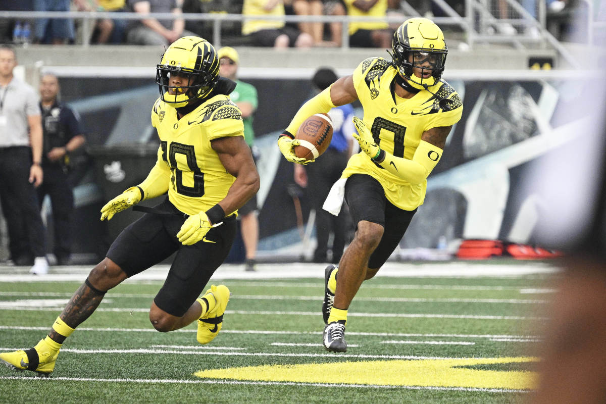 Oregon Ducks cornerback Christian Gonzalez returns an interception against the Eastern Washington Eagles at Autzen Stadium.
